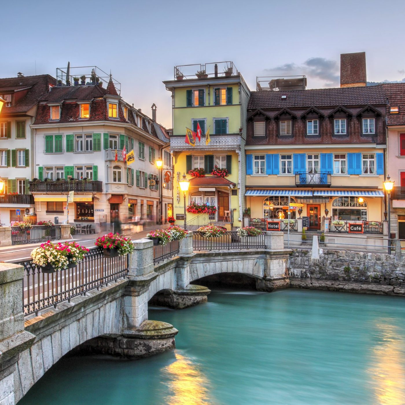 Bridge over the Aare River between Interlaken and Unterseen, in Bern Canton, Switzerland Bridge over the Aare river between Interlaken and Unterseen in Bern Canton, Switzerland at twilight.